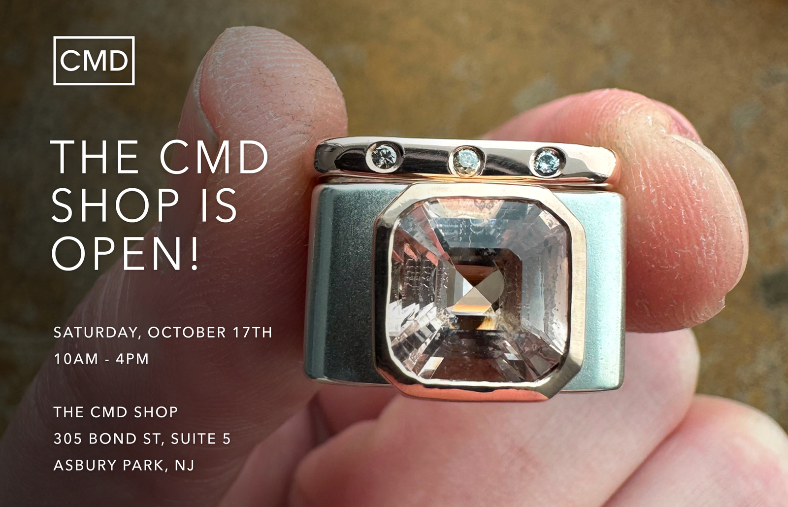 CMD Shop Open Hours in Asbury Park featuring a close-up of a mixed-metal ring stack with a large gemstone
