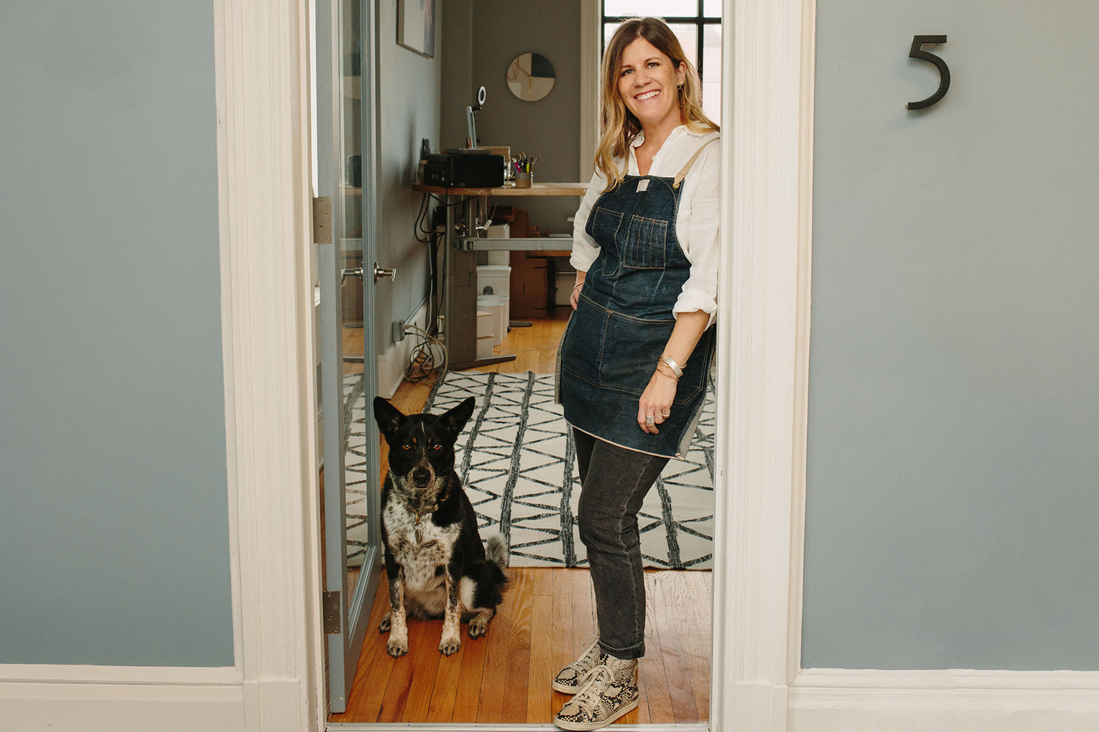 Colleen and Miglia the dog in the doorway at The CMD Shop in Asbury Park New Jersey