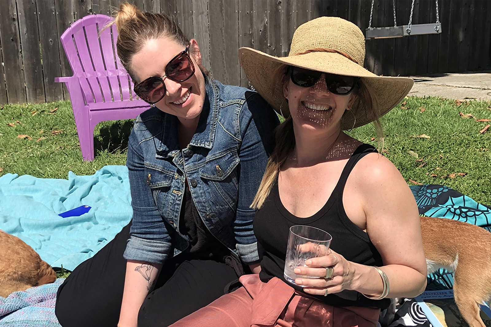Colleen Mauer and her friend Lisa enjoying cocktails together outdoors
