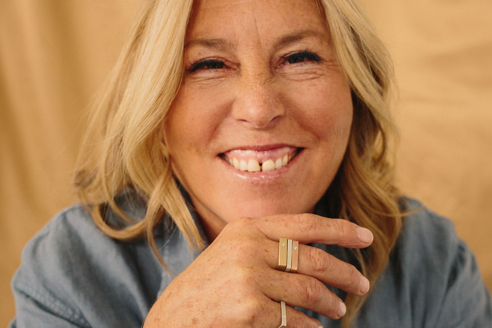 Marilyn Schlossbach wearing CMD rings for the Colleen Mauer Designs Hand Project