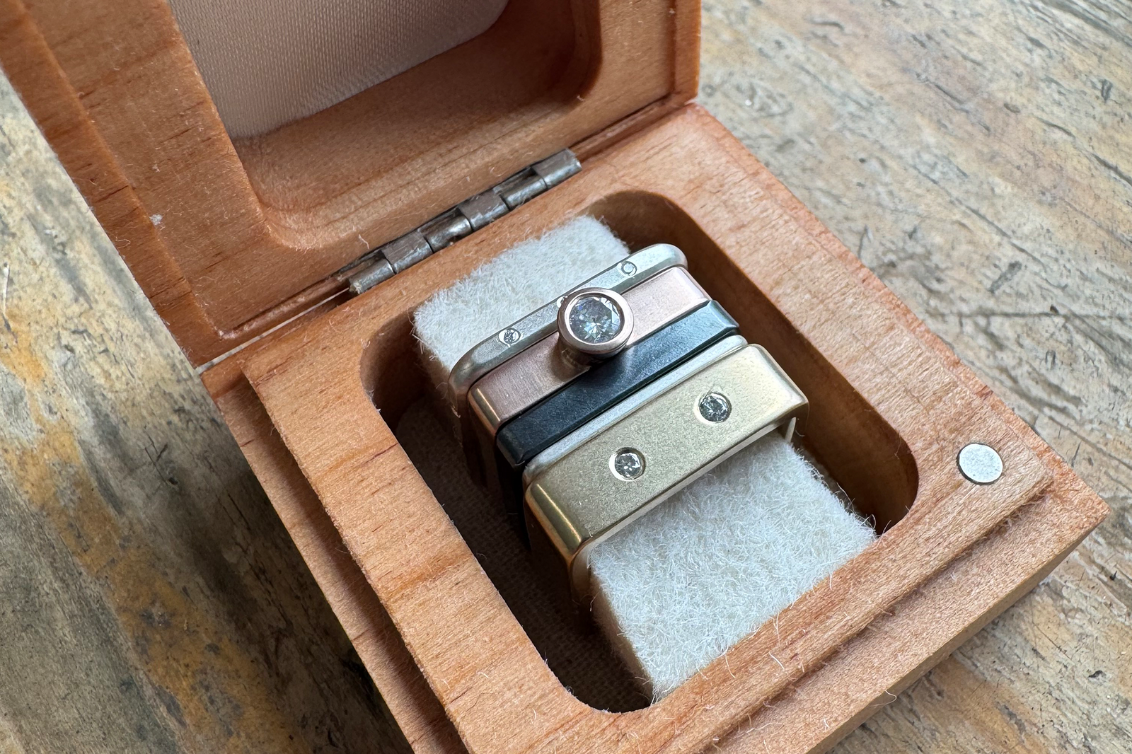 Custom mixed metal and diamond ring stack in a CMD jewelry box