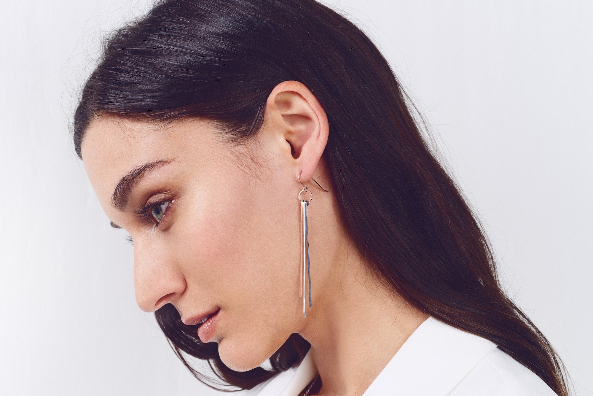 E314t.yg Tri Toned Mixed Metal Stick Earrings in Yellow Gold, Oxidized and Sterling Silver on Model