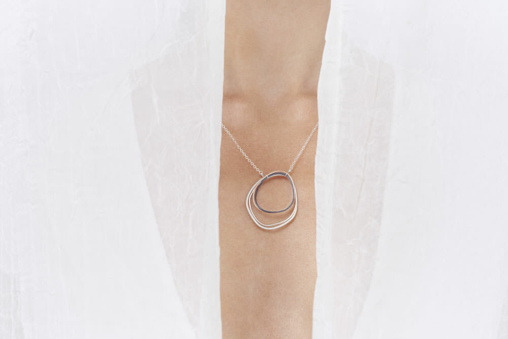 N259s.yg Gold, Black & Silver Large Topography Necklace on Silver Chain - Model Image