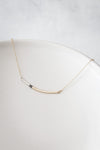 N291g.t.yg Mini Tri-Toned Arc Necklace in Yellow Gold, Silver and Black on Yellow Gold Chain - Lifestyle Image