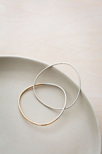 B101.2s.yg 2-Loop Two-Toned and Monotone Interlocking Bangle in Silver and Yellow Gold
