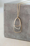 N299g.yg Gold, Black & Silver Long Multi Triangle Necklace - Lifestyle Image